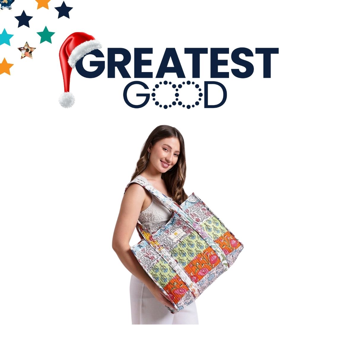 The Greatest Good logo with a Santa hat above a smiling woman holding a large, colourful tote bag. The tote features vibrant patterns and a spacious design, perfect for gifting or daily use